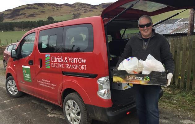 Volunteer delivering food parcel