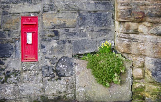 Post box in stone wall in rural Scotland