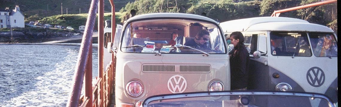 Vintage camper-vans crossing on a ferry