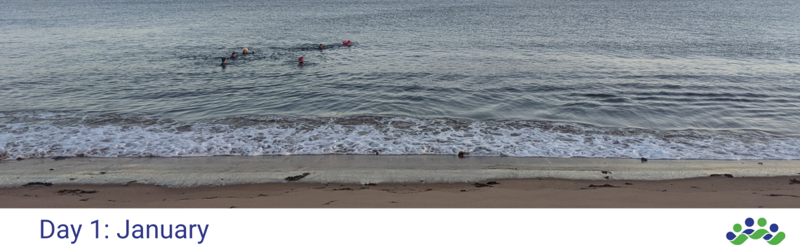 Image of people swimming in the north sea in Scotland